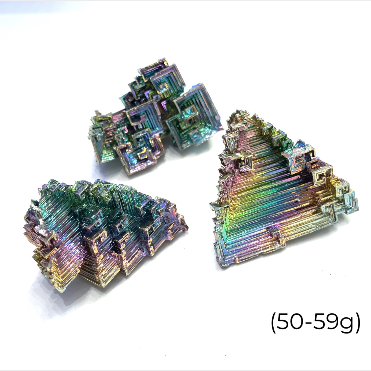 a cluster of  bismuth gemstones  (50-59g) on white background  close up overview