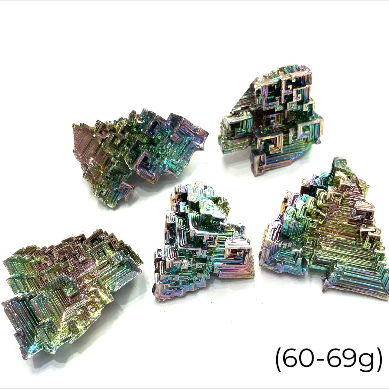 a cluster of  bismuth gemstones  (60-69g) on white background  close up overview