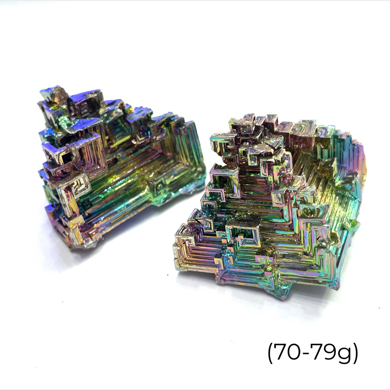 a cluster of  bismuth gemstones  (70-79g) on white background  close up overview
