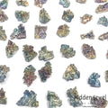 a grouping of bismuth gemstones on white overview