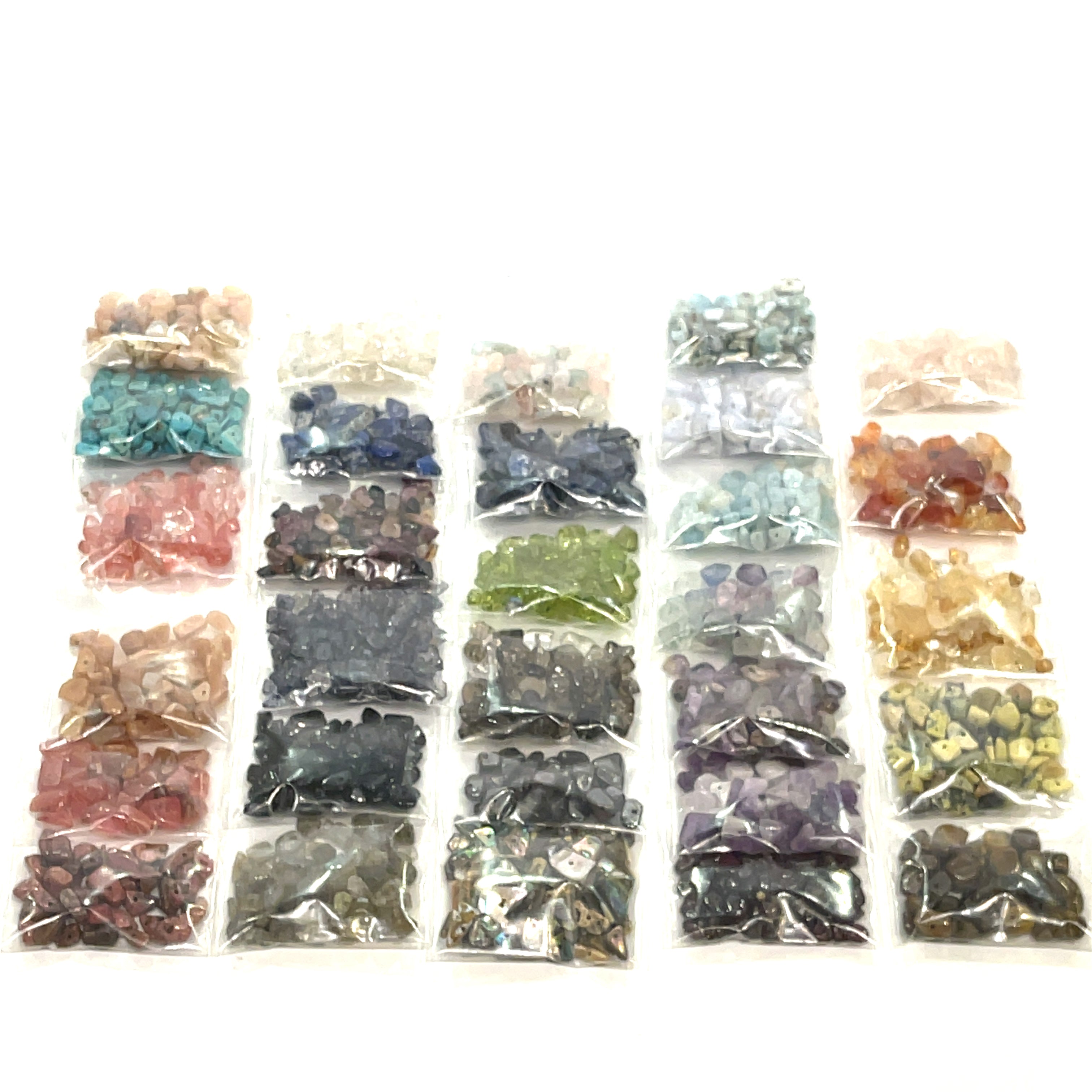a layout of the a large selection of gemstone chip bags, on a white background, front view. 