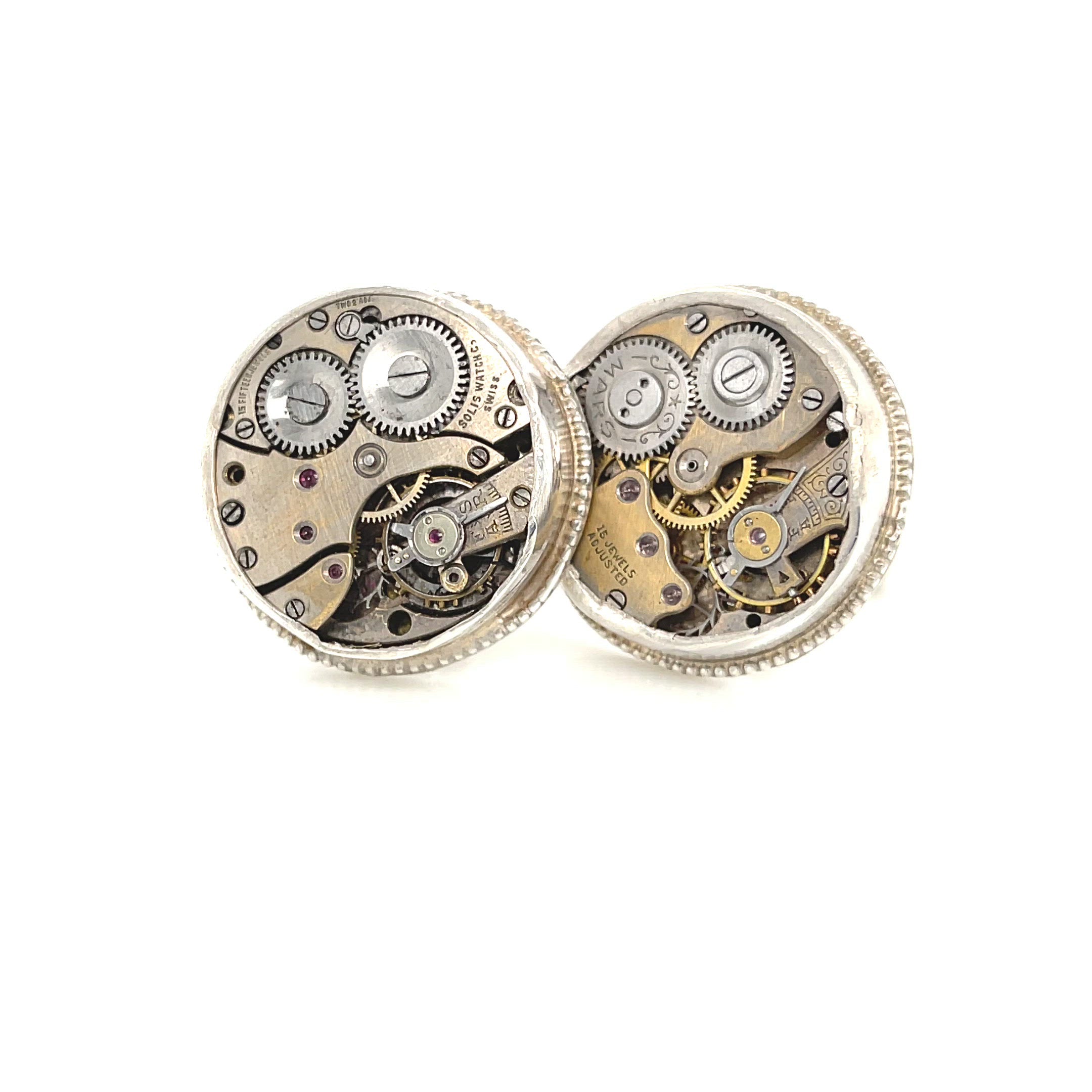 Sterling silver cuff links with mechanical detail handcrafted  in Boston on a white background left angle view. video