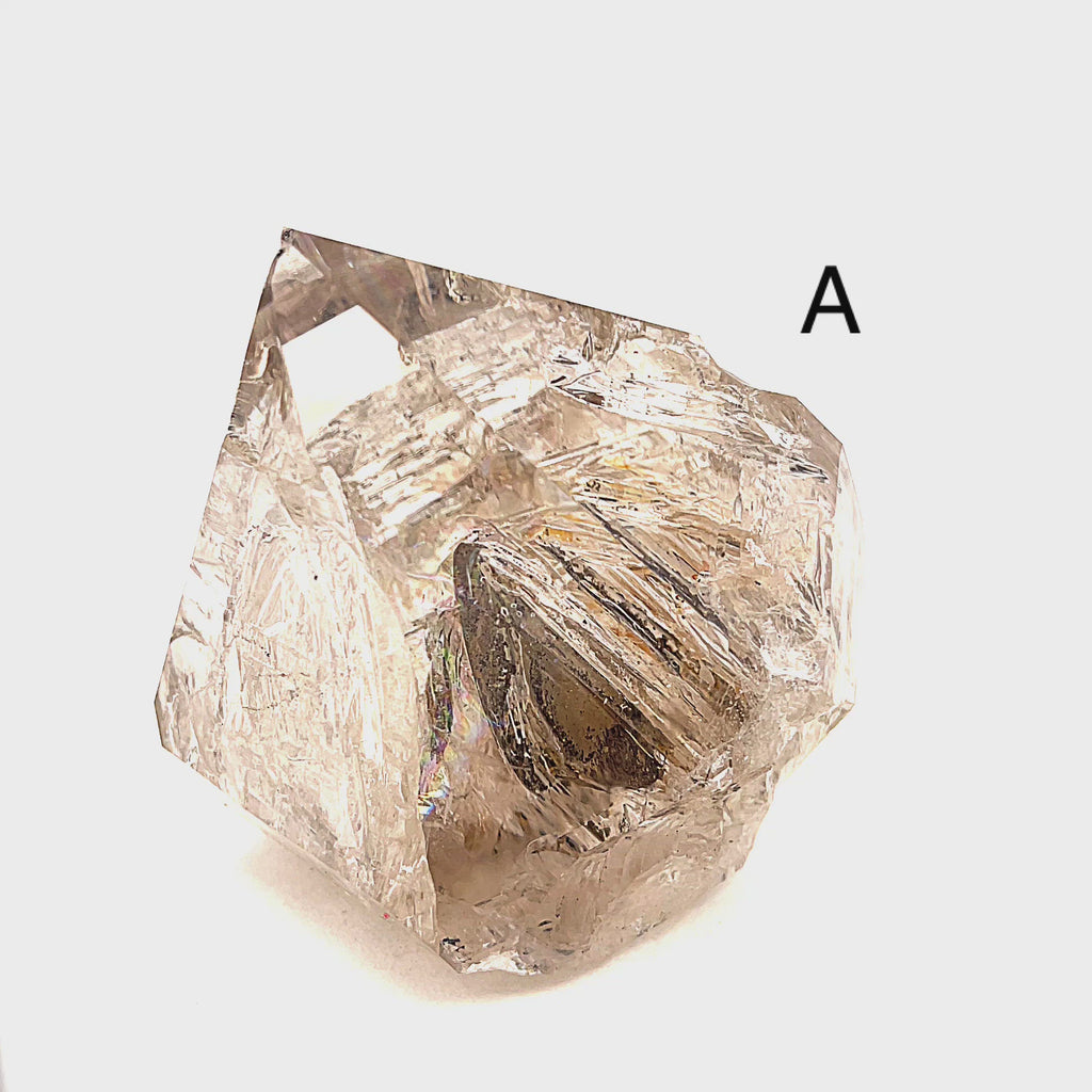 A collection of raw Herkimer diamond gemstones (A) displayed on a white background, front,  overview. video