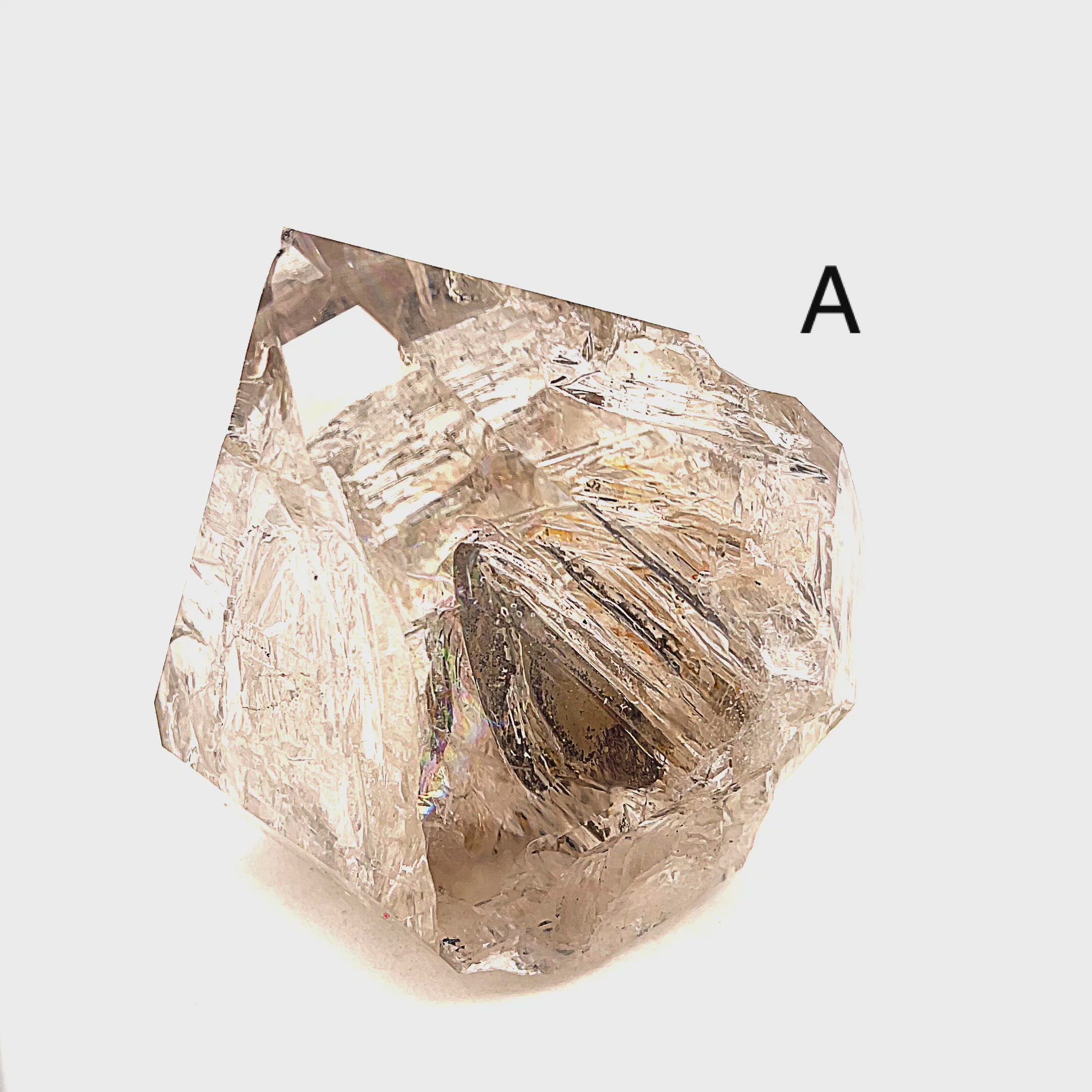 A collection of raw Herkimer diamond gemstones (A) displayed on a white background, front,  overview. video