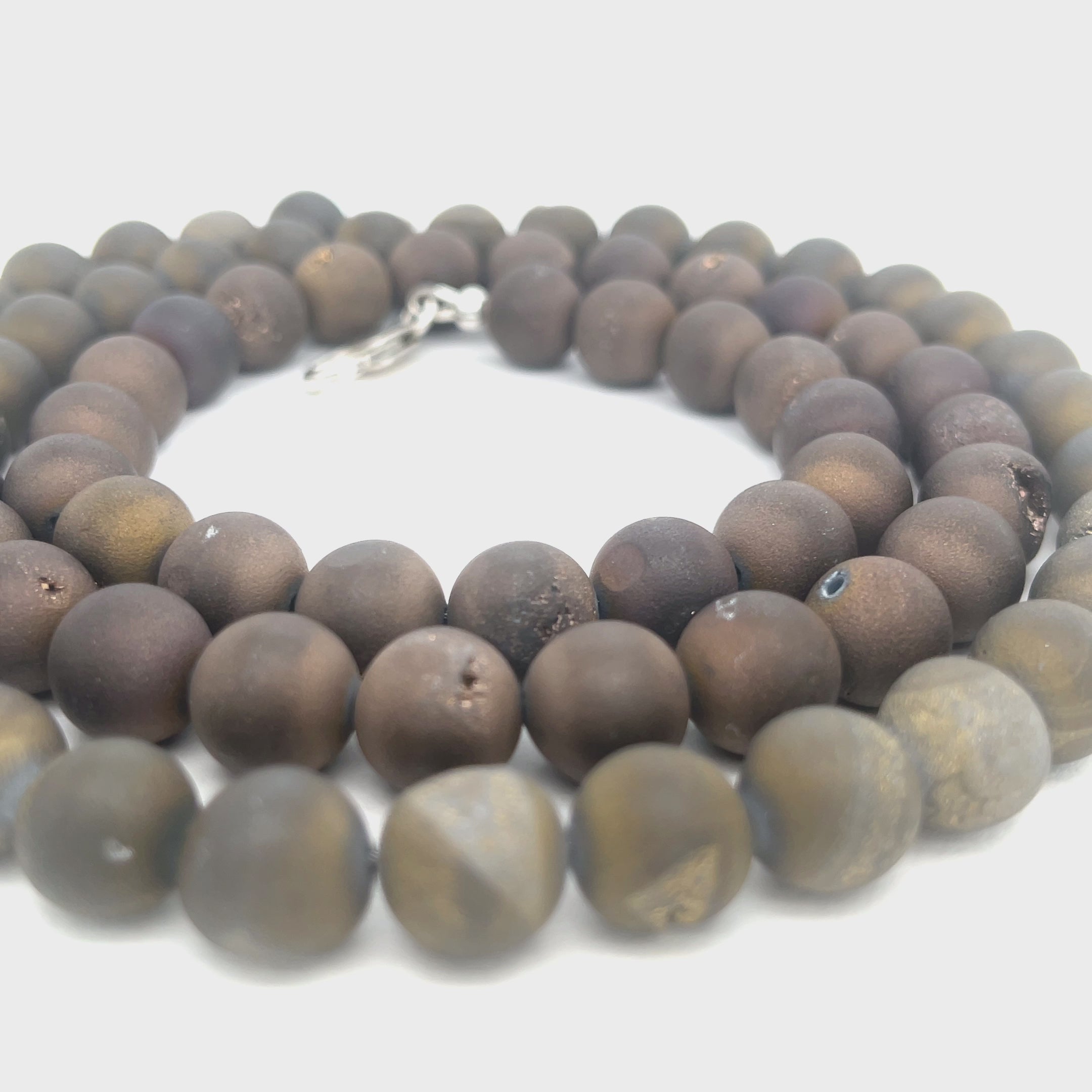 A Unisex Druzy Agate Necklace styled for layering and everyday wear, on a white background, center-long overview.  video