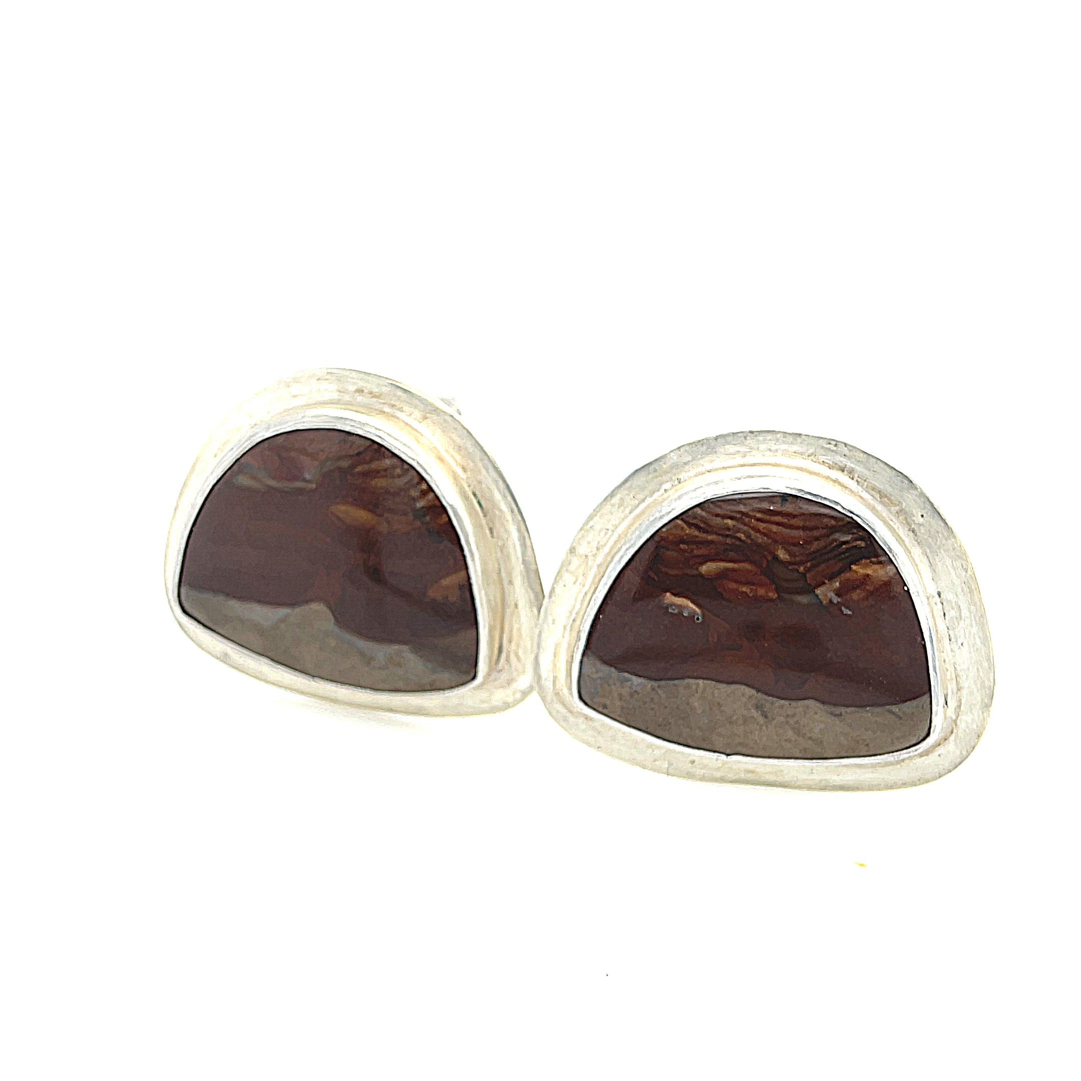 A pair of sterling silver cufflinks featuring rounded-triangle-shaped mookite jasper gemstones, bezel-set in a round sterling silver setting. On a white background, right-angle front view. video