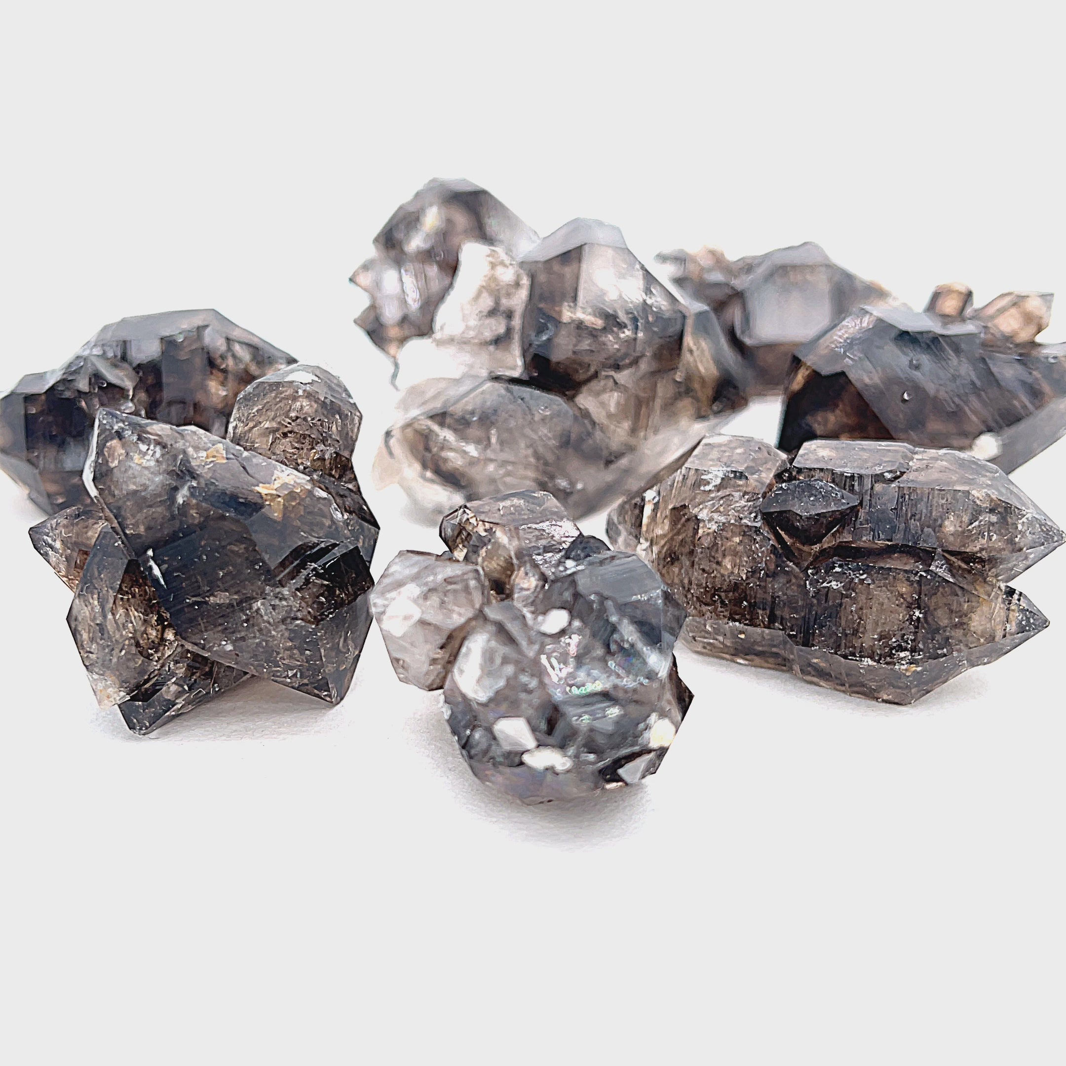 Raw Smoky Quartz cluster from Mooralla, Australia displayed on white background, Hidden Jewel of the South End front view. video