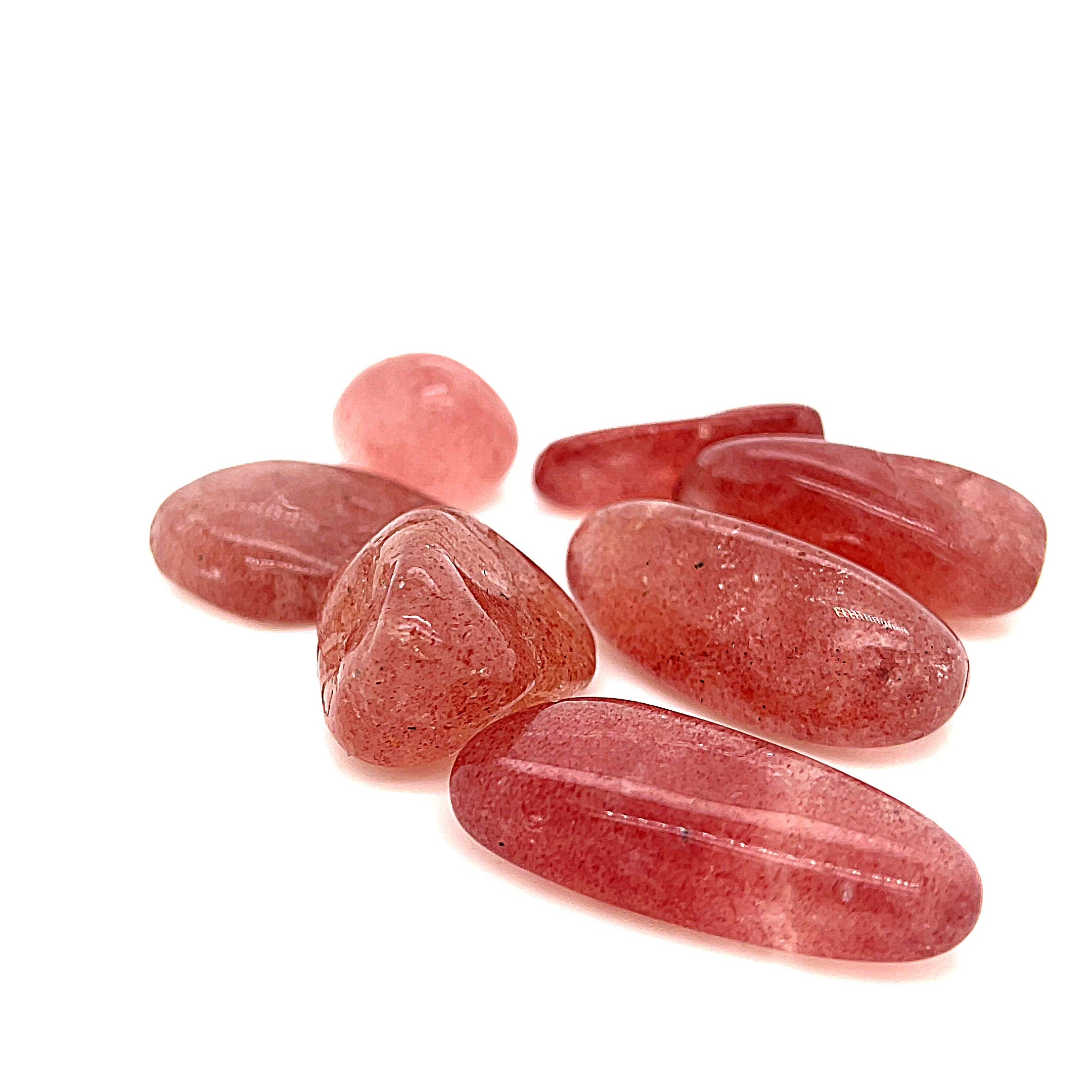 A group of Strawberry Quartz tumble gemstone  on a white background, front view. video