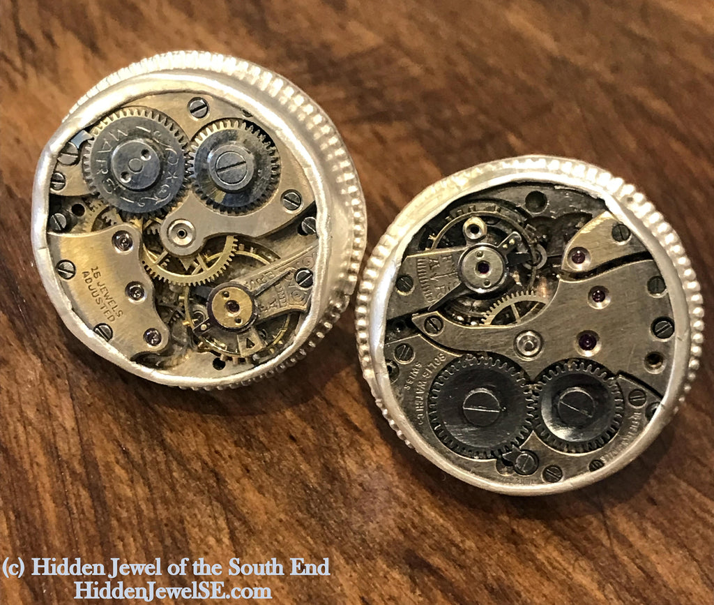 Sterling silver cuff links with mechanical detail handcrafted  in Boston on a wooden background  a   front overview.
